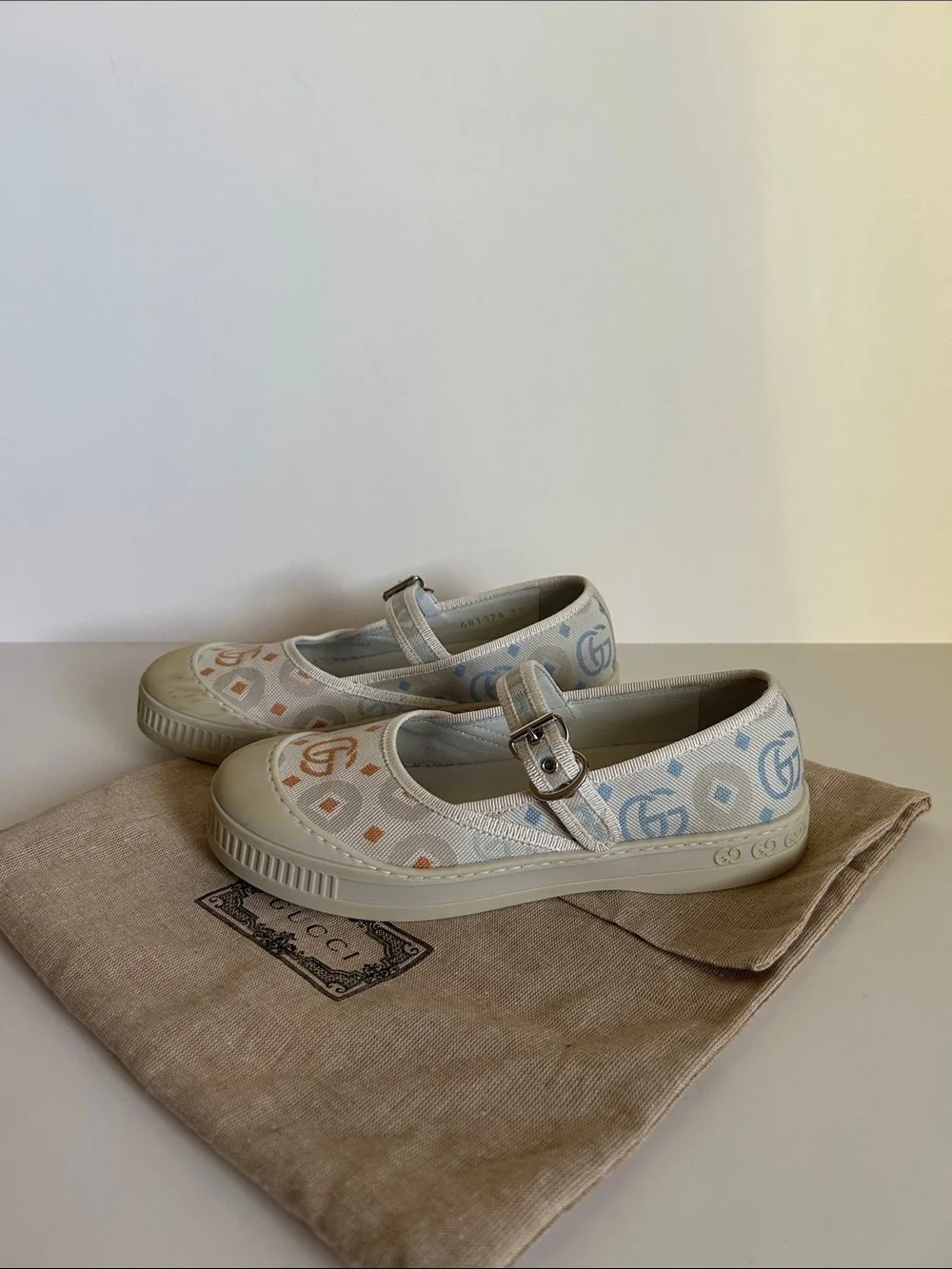 Gucci Ivory Canvas Mary Jane Flats with Pastel Logo Print